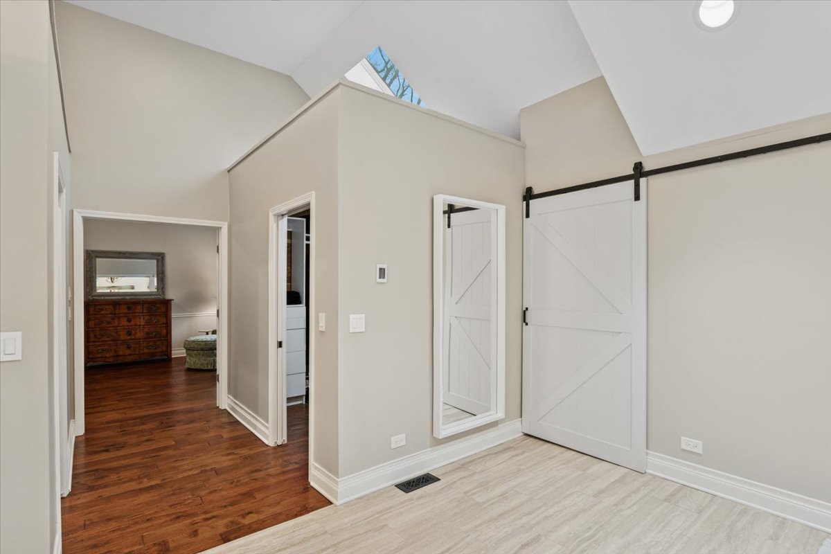 2250 Lisson Road Naperville, IL 60565 - Photo 30 of 53 a view of a hallway with wooden floor and closet area