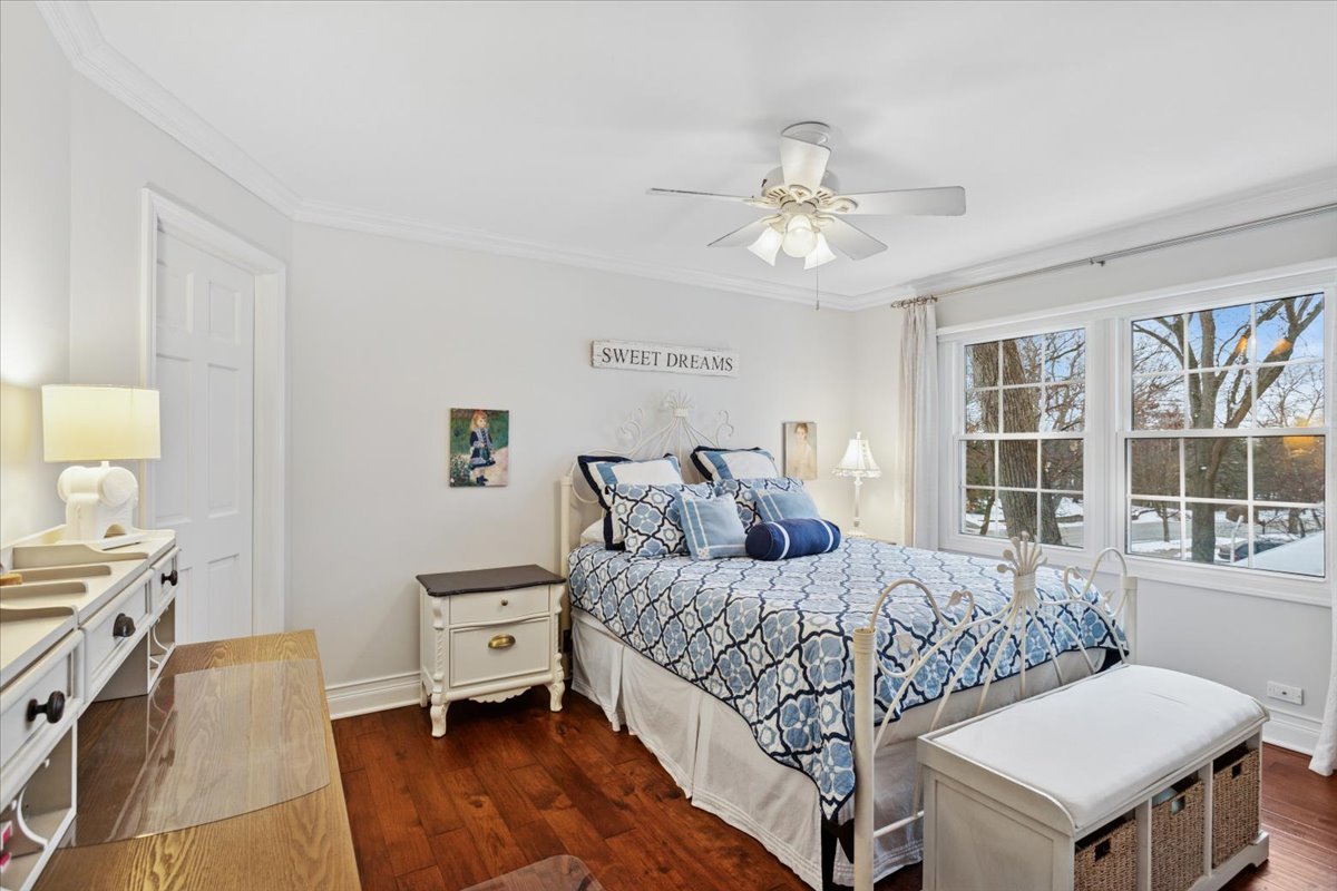 2250 Lisson Road Naperville, IL 60565 - Photo 32 of 53 a bedroom with a bed and a chandelier