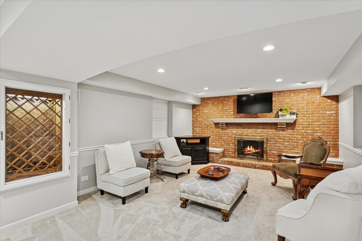 2250 Lisson Road Naperville, IL 60565 - Photo 39 of 53 a living room with furniture and a fireplace