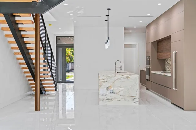 a view of an outdoor space and a front view of a house