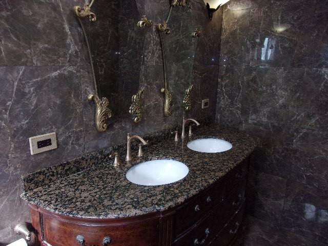 1564 Sunset Way Weston, FL 33327 - Photo 14 of 40 a bathroom with a granite countertop sink a mirror and vanity