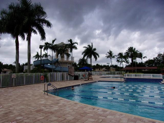 1564 Sunset Way Weston, FL 33327 - Photo 24 of 40 swimming pool with outdoor seating and lake view