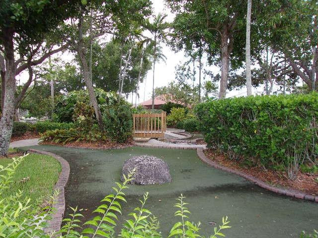 1564 Sunset Way Weston, FL 33327 - Photo 26 of 40 a view of a lake with a yard