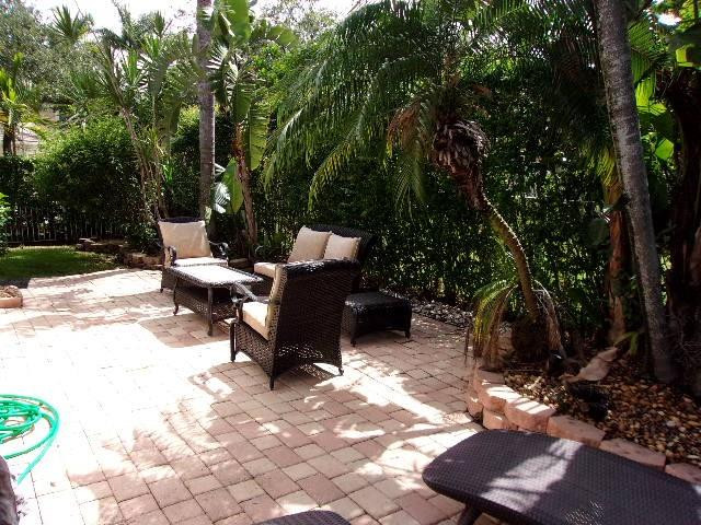 1564 Sunset Way Weston, FL 33327 - Photo 27 of 40 a view of a backyard with sitting area