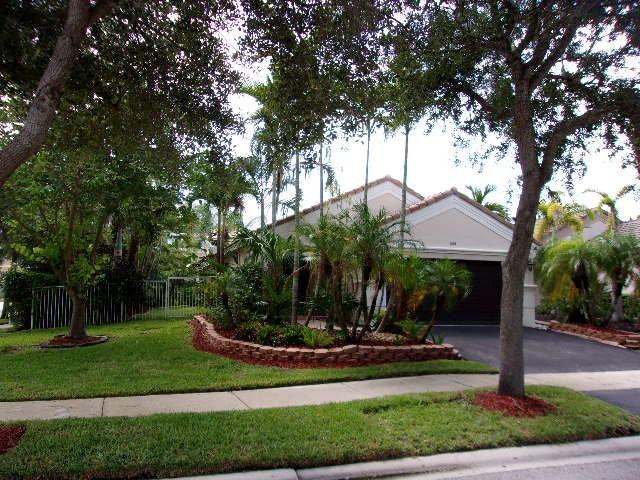 1564 Sunset Way Weston, FL 33327 - Photo 37 of 40 a view of a house with a yard and tree s