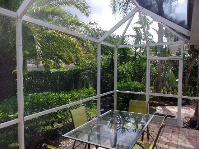 1564 Sunset Way Weston, FL 33327 - Photo 4 of 40 a view of a chair and tables in the balcony