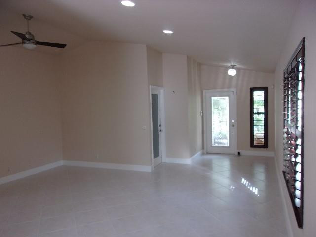 1564 Sunset Way Weston, FL 33327 - Photo 7 of 40 wooden floor in an empty room with a window