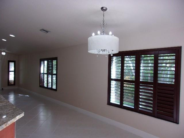 1564 Sunset Way Weston, FL 33327 - Photo 8 of 40 a view of a windows and chandelier in a room