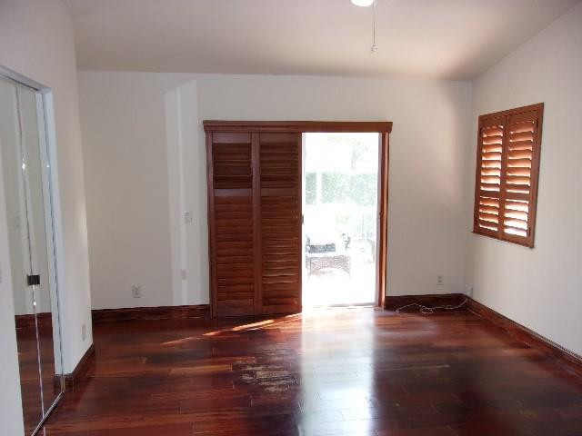 1564 Sunset Way Weston, FL 33327 - Photo 9 of 40 an empty room with wooden floor and windows