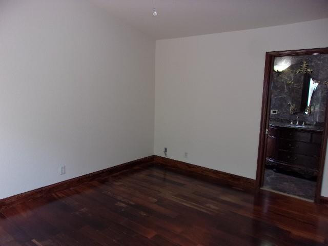 1564 Sunset Way Weston, FL 33327 - Photo 10 of 40 a view of a room with wooden floor and exposed radiator