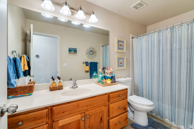 1602 Renaissance Way Springville, UT 84663 - Photo 21 of 42 Full bath with vanity, a shower with curtain, and light tile patterned flooring