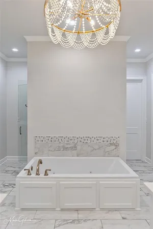 a bathroom with a bathtub and a sink