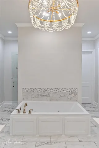 a bathroom with a bathtub and a sink