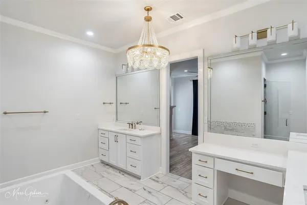 a bathroom with a double vanity sink mirror and shower