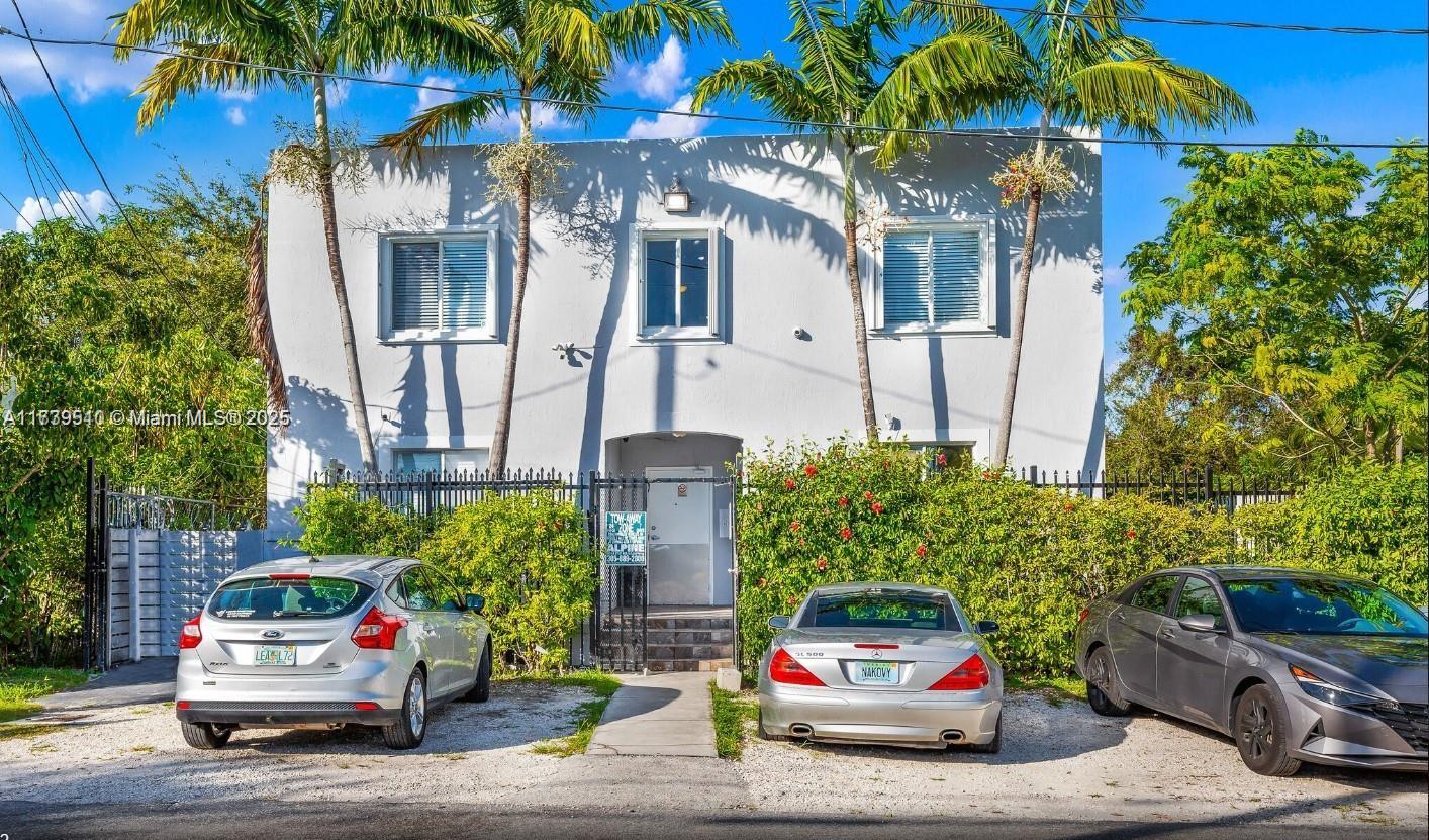 121 Northeast 55th Street Miami, FL 33137 - Photo 1 of 16 a car parked in front of a building