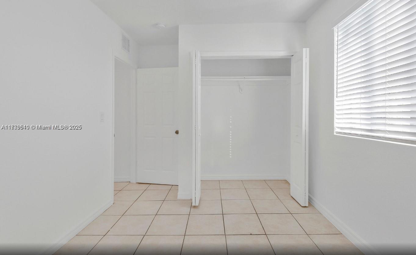 121 Northeast 55th Street Miami, FL 33137 - Photo 11 of 16 a view of an empty room and window