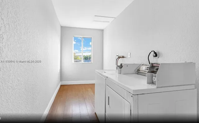 a kitchen with a sink and chandelier