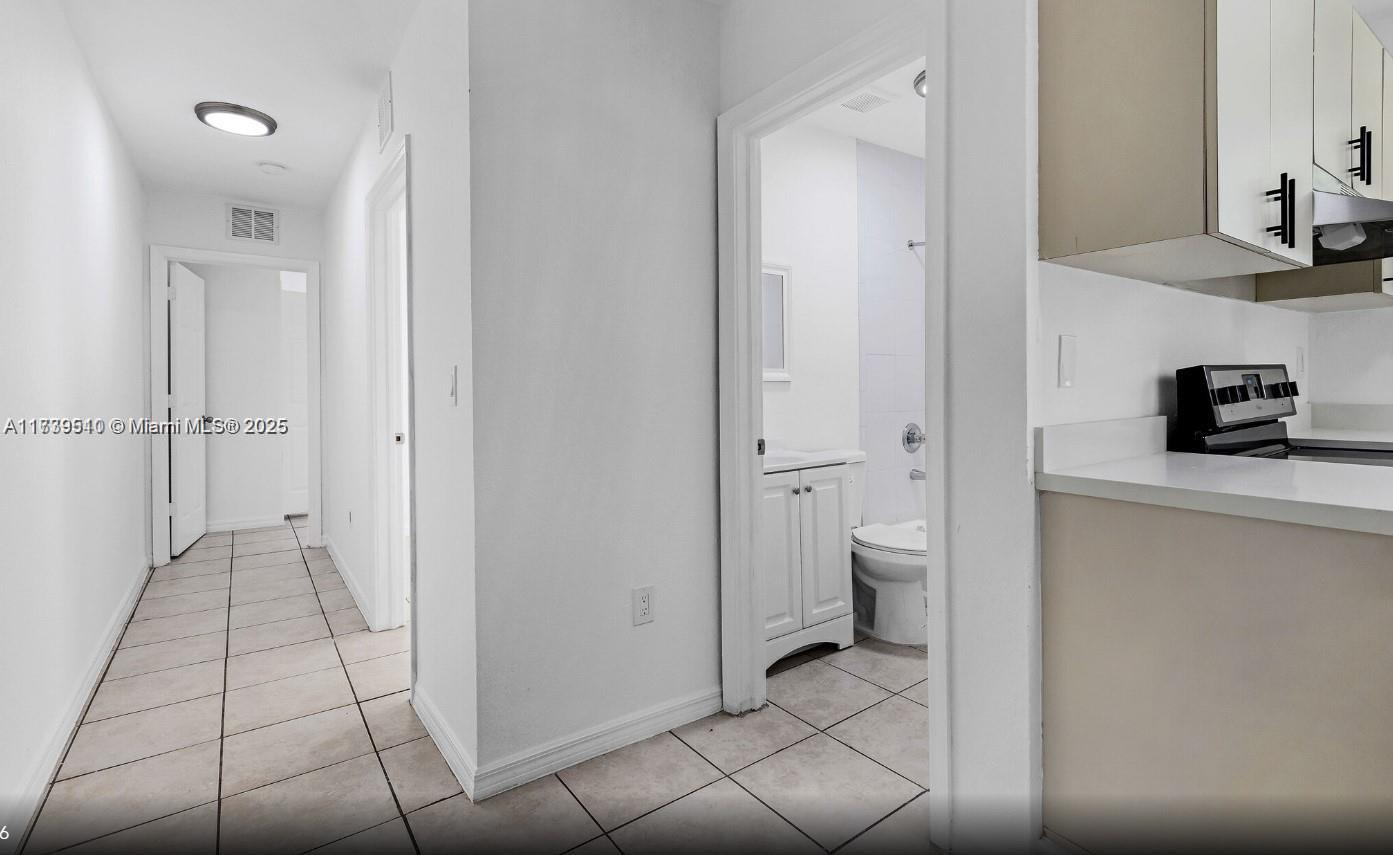 121 Northeast 55th Street Miami, FL 33137 - Photo 6 of 16 a bathroom with a toilet