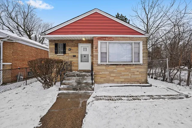a front view of a house with glass windows