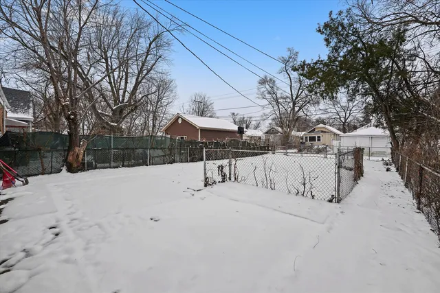 a view of snow on the roadside
