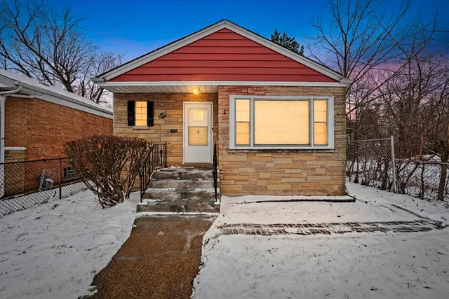 a front view of a house with glass windows