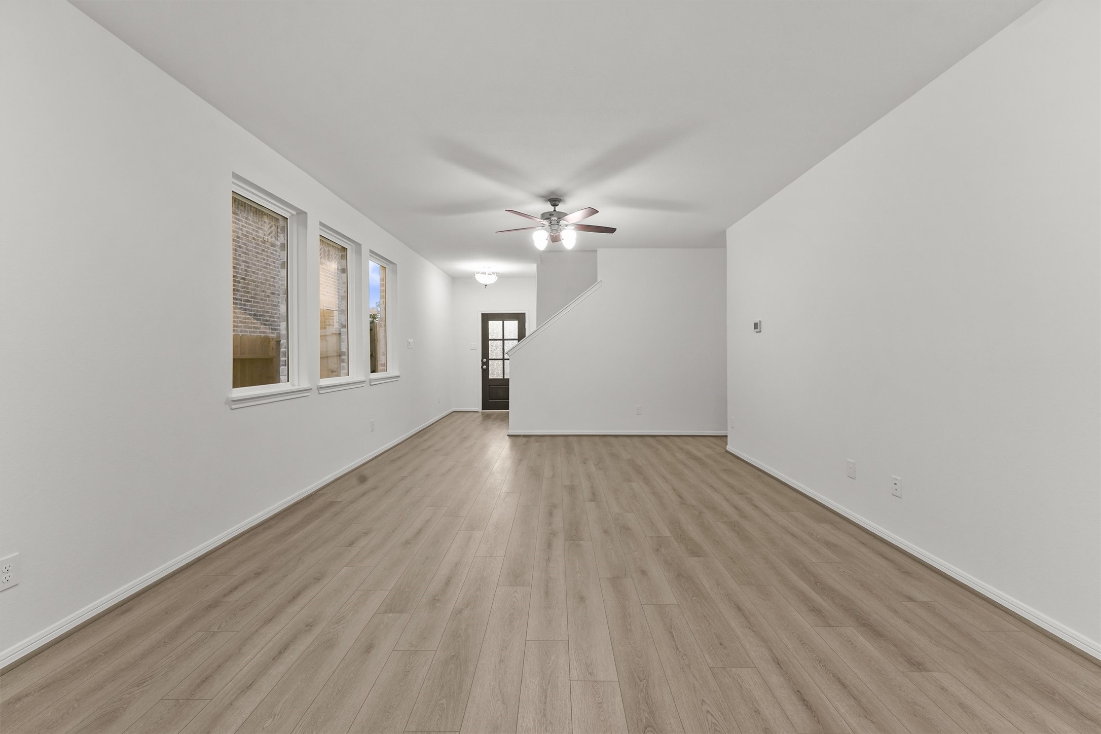 19111 Hazel Firs Court Magnolia, TX 77355 - Photo 13 of 34 wooden floor in an empty room with a window