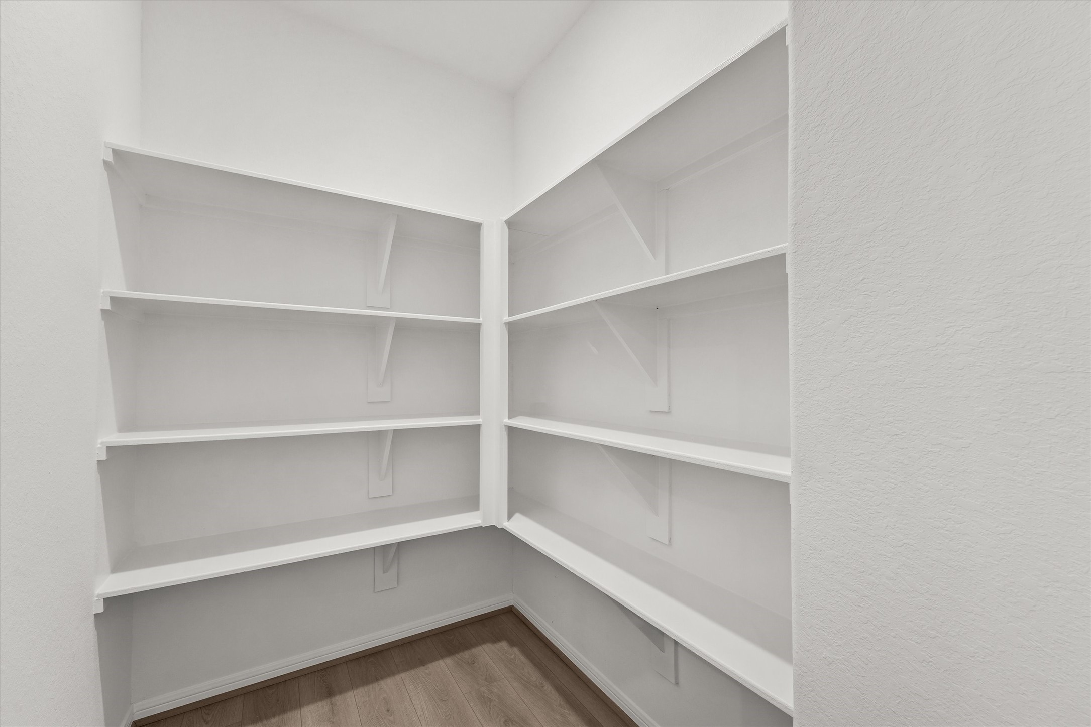 19111 Hazel Firs Court Magnolia, TX 77355 - Photo 17 of 34 a view of walk in closet with empty racks