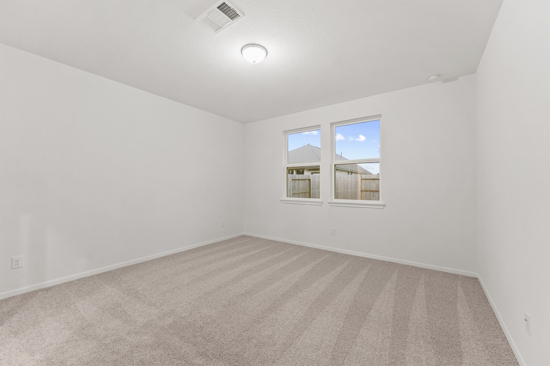 19111 Hazel Firs Court Magnolia, TX 77355 - Photo 18 of 34 an empty room with windows