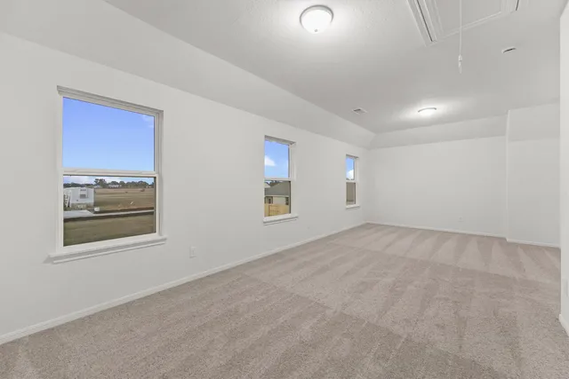 a view of empty room with windows