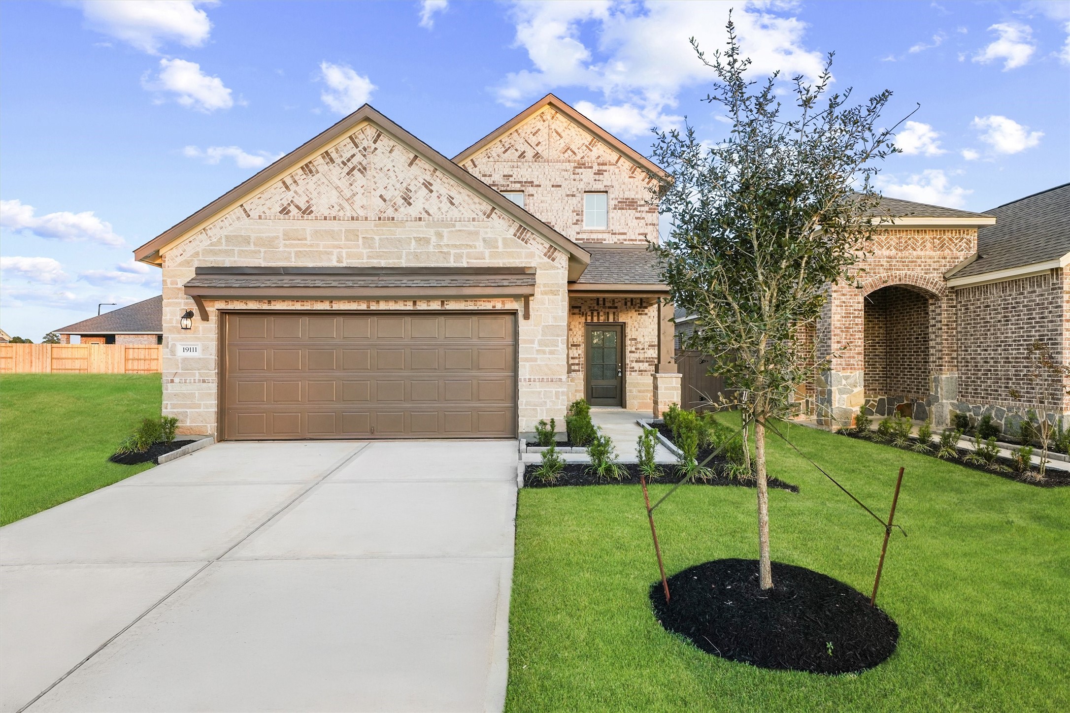 19111 Hazel Firs Court Magnolia, TX 77355 - Photo 27 of 34 a front view of a house with garden