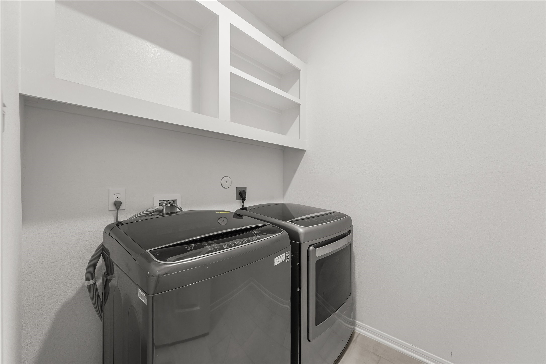 19111 Hazel Firs Court Magnolia, TX 77355 - Photo 31 of 34 a utility room with dryer and washer