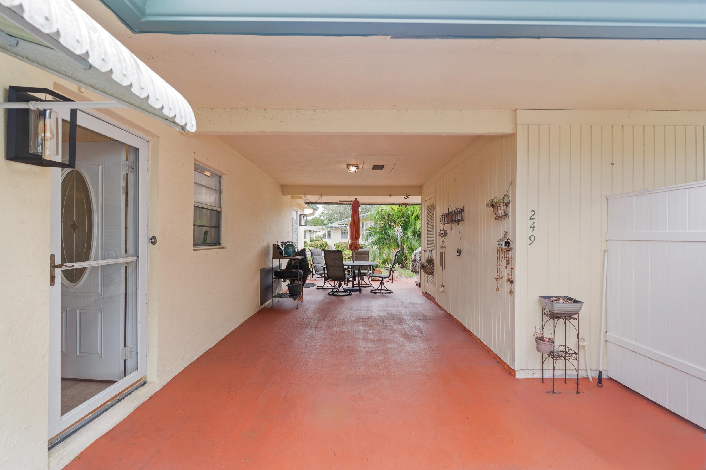 249 Cardinal Lane Delray Beach, FL 33445 - Photo 3 of 36 Carport