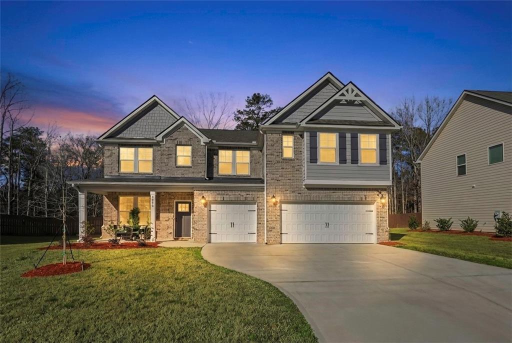 3258 Thicket Lane Atlanta, GA 30349 - Photo 1 of 38 a front view of a house with garden