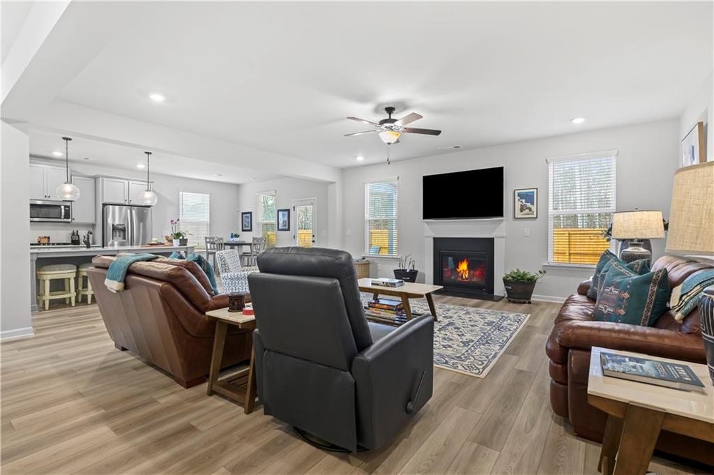 3258 Thicket Lane Atlanta, GA 30349 - Photo 14 of 38 a living room with furniture a fireplace and a flat screen tv