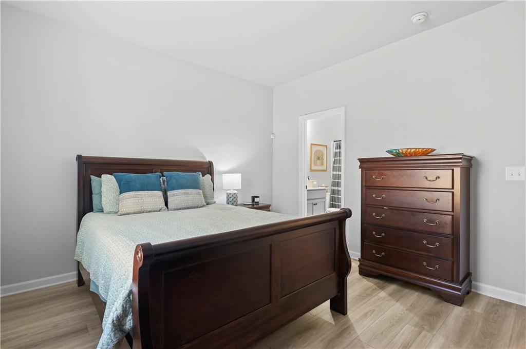 3258 Thicket Lane Atlanta, GA 30349 - Photo 16 of 38 a bedroom with a bed and a dresser