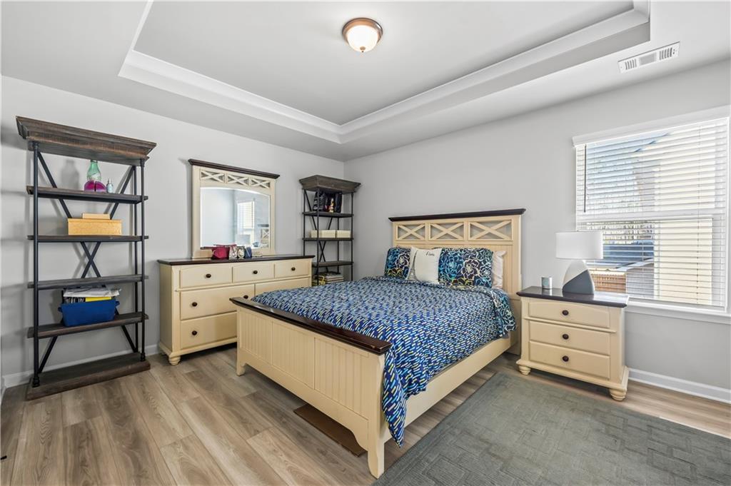 3258 Thicket Lane Atlanta, GA 30349 - Photo 26 of 38 a bedroom with a bed and a window