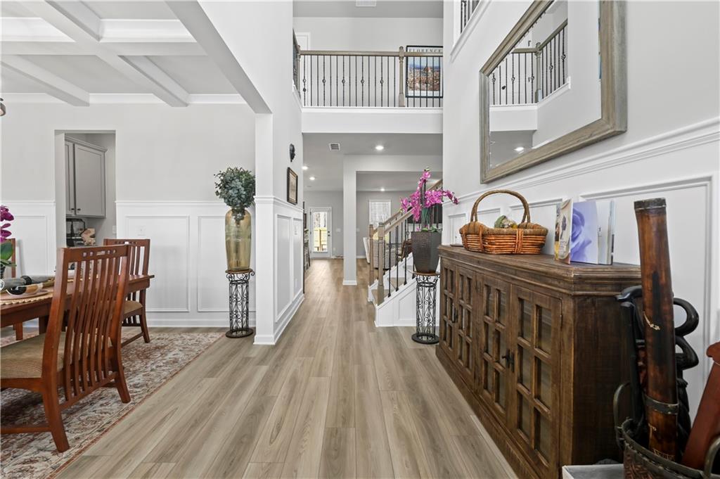 3258 Thicket Lane Atlanta, GA 30349 - Photo 3 of 38 a view of a livingroom with furniture stairs wooden floor and windows