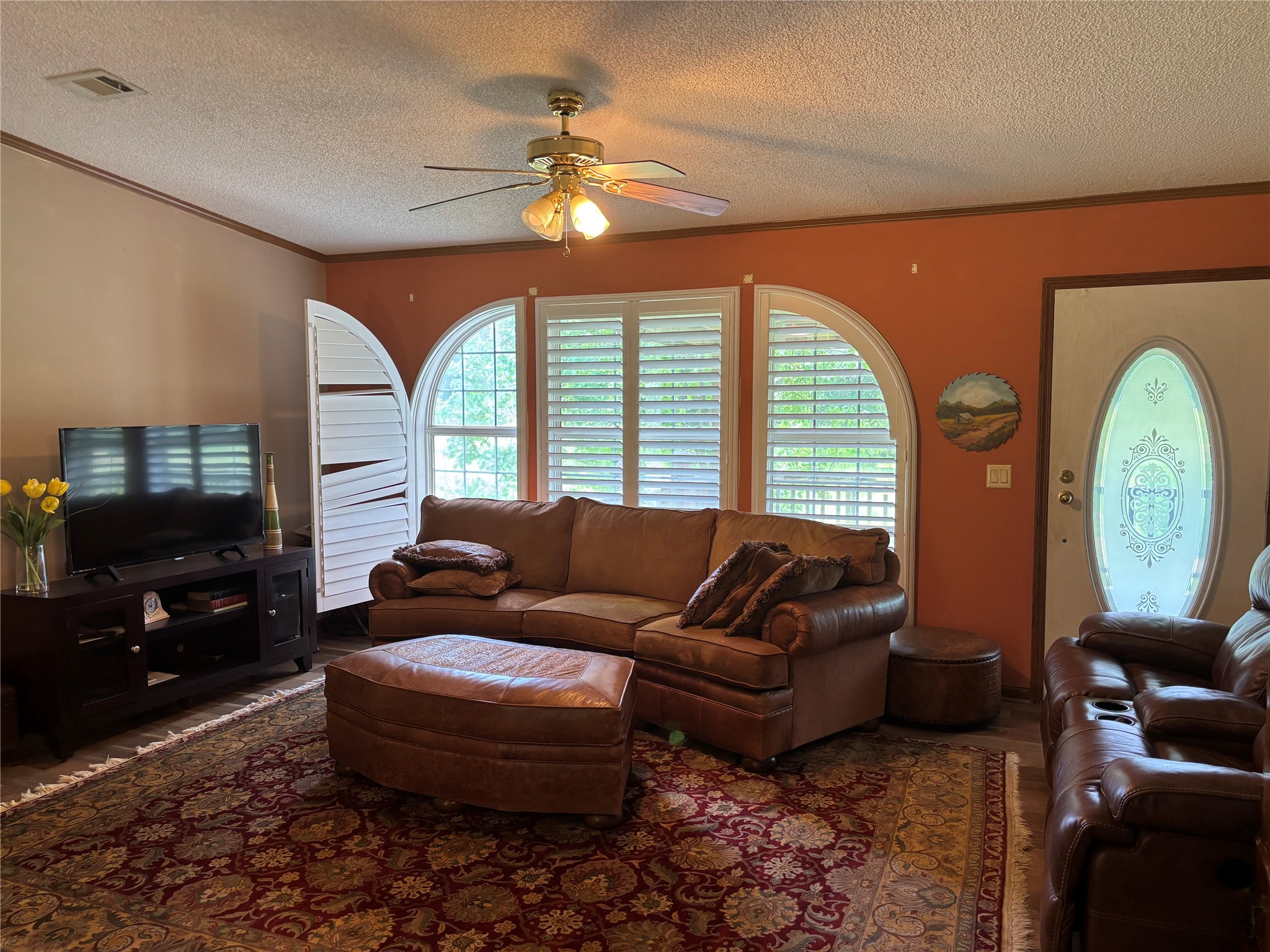 35599 State Highway South Buna, TX 77612 - Photo 14 of 40 a living room with furniture and a flat screen tv