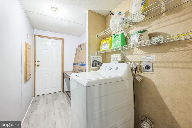 a view of a house with a yard and deck