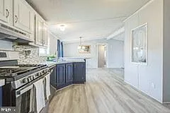 a kitchen with stainless steel appliances granite countertop a stove and a sink
