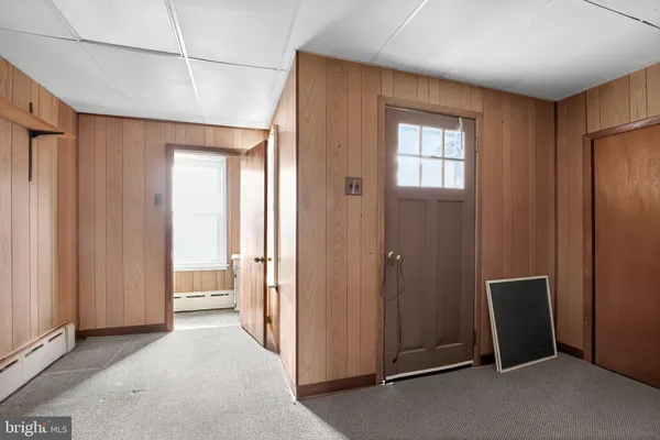a view of a hallway with bathroom