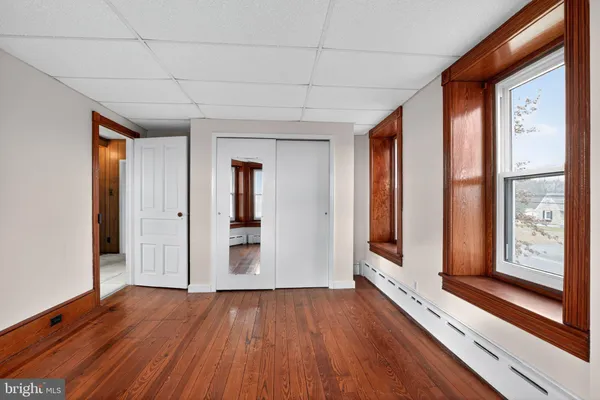 a view of front door with wooden floor
