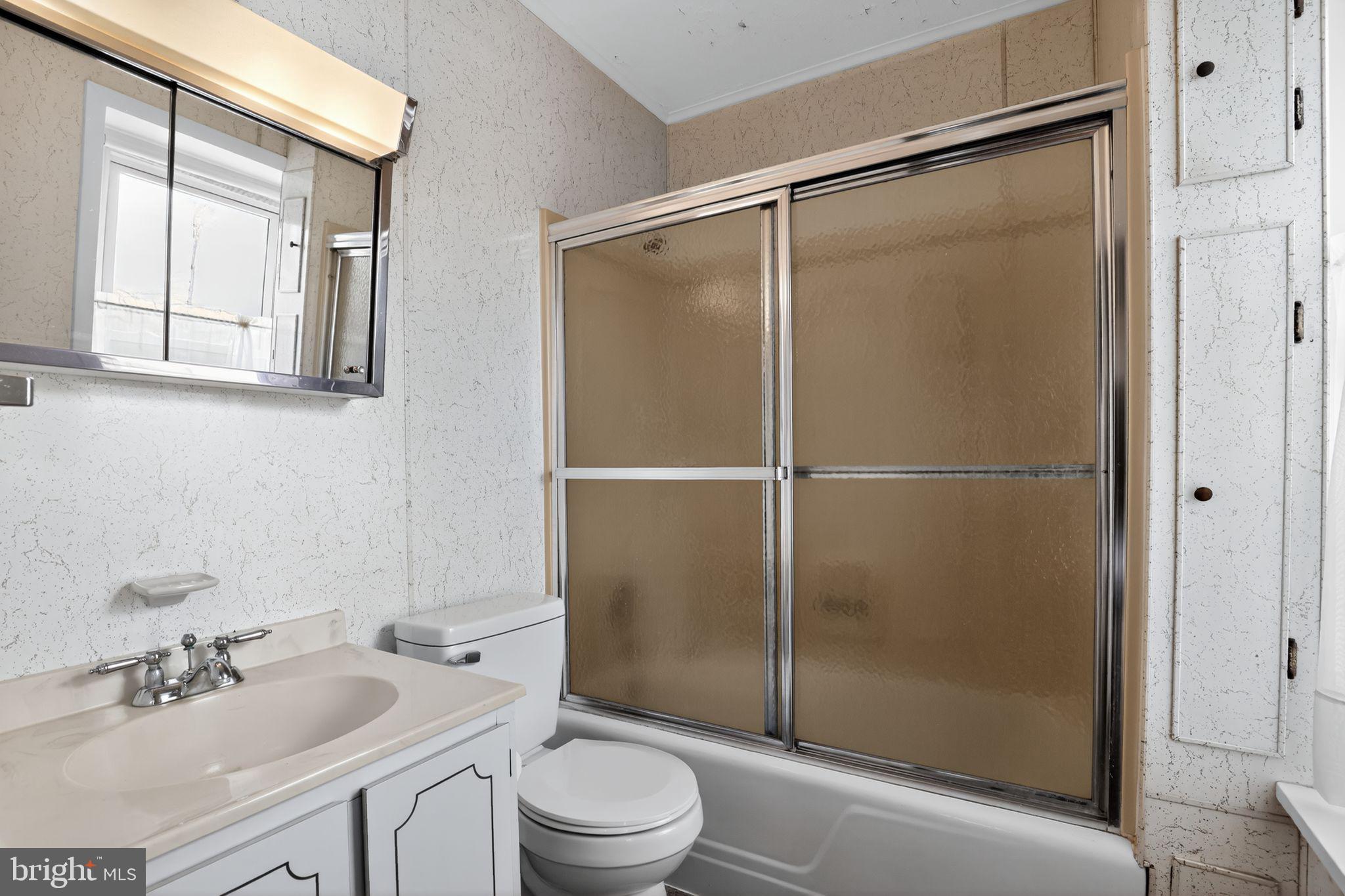 411 Swamp Pike Pottstown, PA 19464 - Photo 19 of 41 a bathroom with a shower sink vanity mirror and toilet