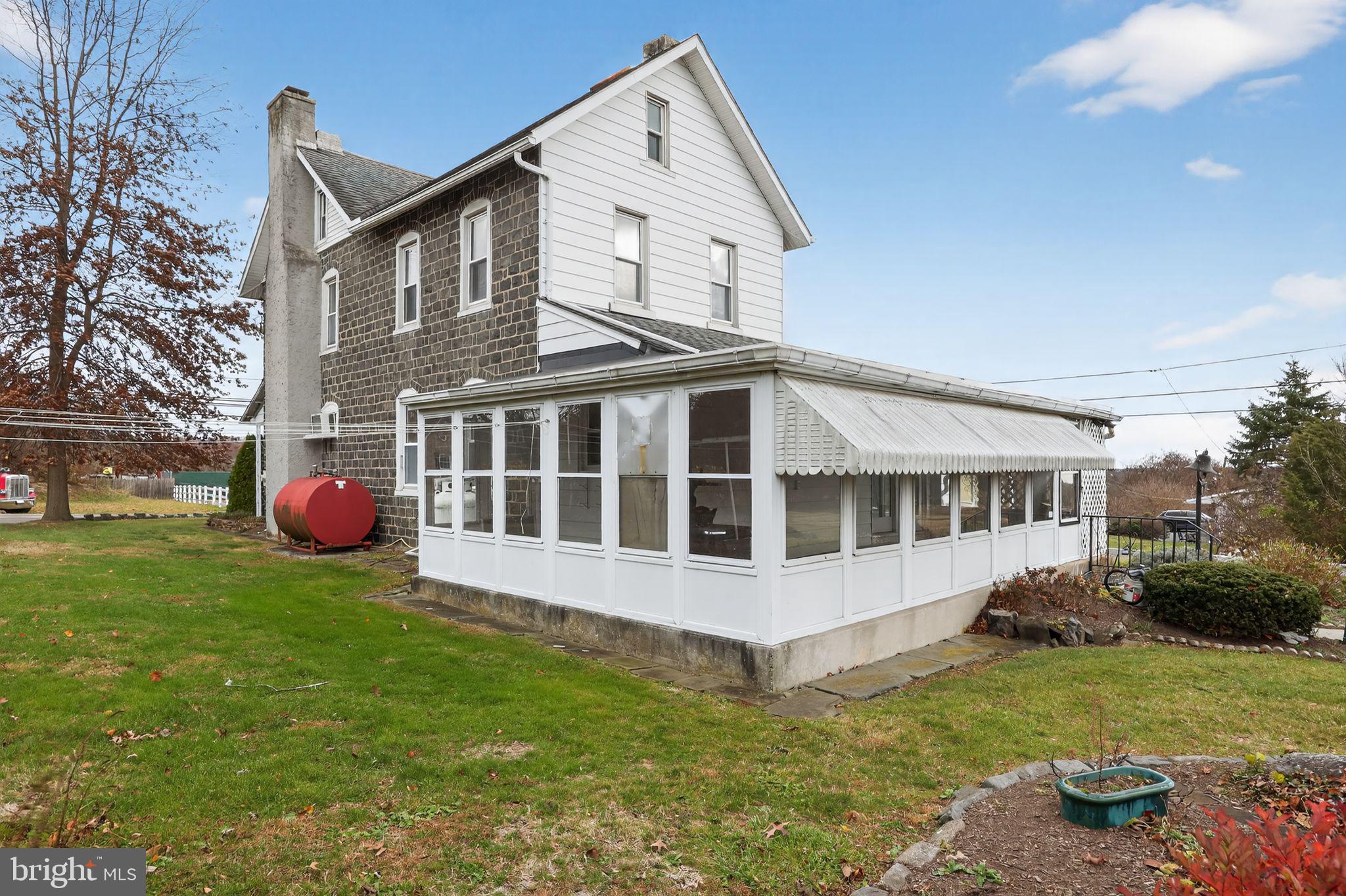 411 Swamp Pike Pottstown, PA 19464 - Photo 26 of 41 a view of a house with a backyard and a garden