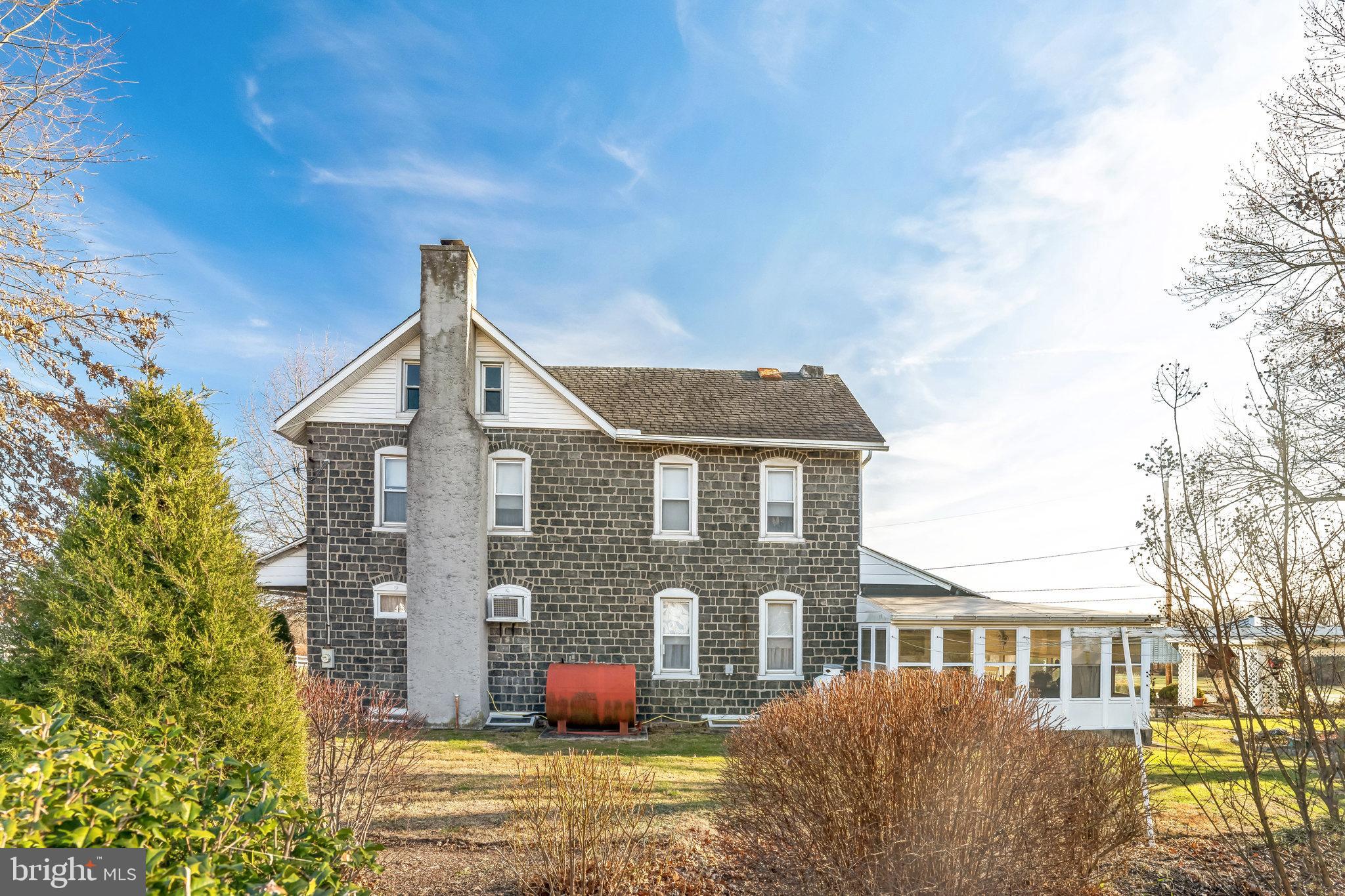 411 Swamp Pike Pottstown, PA 19464 - Photo 28 of 41 a front view of a house with garden