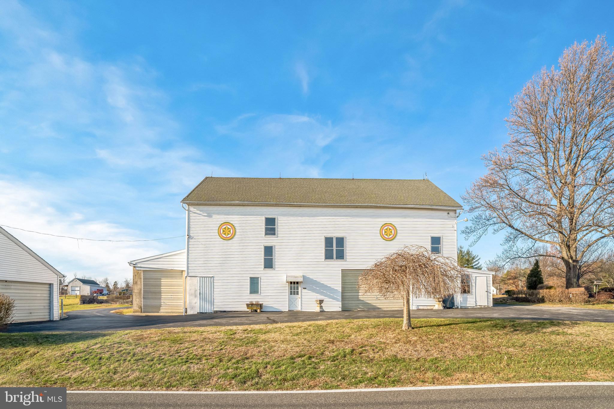 411 Swamp Pike Pottstown, PA 19464 - Photo 31 of 41 a view of a white house with a yard