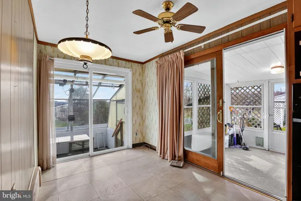 a very nice looking room with a large window and a chandelier