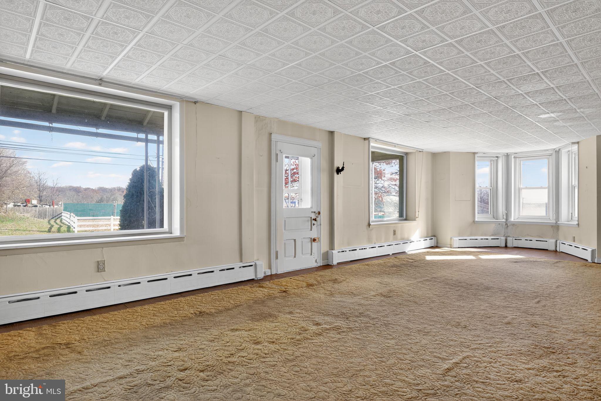 411 Swamp Pike Pottstown, PA 19464 - Photo 7 of 41 a view of an empty room with a window