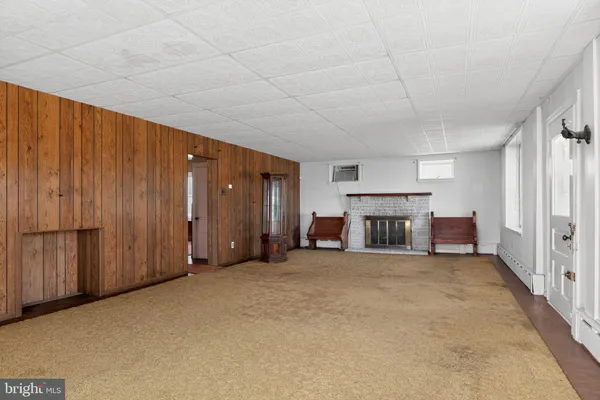 a view of an empty room with closet and garage
