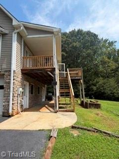 7620 Grapevine Road Lewisville, NC 27023 - Photo 49 of 49 Side view of underneath top porch/deck